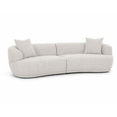 Modern curved sectional sofa upholstered in textured grey and white fabric, offering plush seating and a stylish centerpiece for contemporary living rooms.