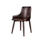 Capri Dining Chair with vintage faux leather upholstery and sleek mid-century modern design, offering comfort and timeless style for dining rooms and contemporary spaces.