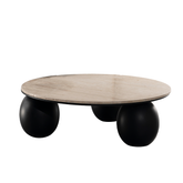 Cava coffee table with round travertine stone top and bold black sphere base, a modern statement piece.