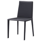 Como Dining Chair featuring premium saddle leather upholstery and a sturdy carbon steel frame, offering sleek, modern, and comfortable seating for dining or office spaces.