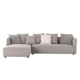 Modern L-shaped sectional sofa upholstered in high-quality fabric with plush seating and metal legs for contemporary living rooms.