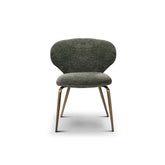 Modern green fabric dining chair with upholstered seat and sleek brass legs, a designer furniture piece for contemporary dining rooms.