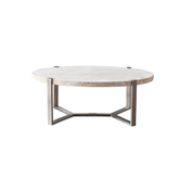 Elegant Pietra coffee table with organic travertine surface and silver legs, combining natural beauty with modern elegance.