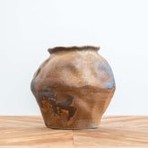 Amina Medium vintage-inspired ceramic vase with textured aged surface and subtle dents, ideal as a centerpiece or decorative accent for indoor or outdoor spaces.