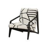 Prague Accent Chair featuring a bold black and white pattern with a sleek veneer base, perfect for modern living rooms.