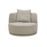 The Umea Swivel Armchair upholstered in premium textured woven fabric, featuring a sculptural curved backrest and smooth 360-degree swivel base for modern versatility.