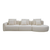 A 3.35-meter Vihta sectional sofa upholstered in soft woven fabric, featuring a rounded moon-shaped chaise in a bright, minimalist living room with natural light.