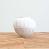 Artisan small ceramic vase featuring expressive brush strokes and subtle unfinished details, perfect as a standalone décor piece or for floral arrangements.