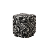 Arvika Ottoman in eye-catching patterned fabric with modern compact design, versatile as footrest or accent seat for contemporary interiors