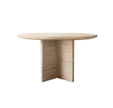 Atrani Round Table made of natural travertine stone in a neutral tone, styled in a modern dining room with minimalist decor.