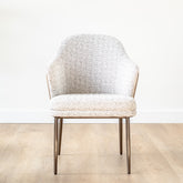 Colle Dining Chair with light grey fabric seat, saddle leather back, and stainless steel legs, modern luxury dining chair for contemporary interiors.