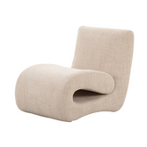 Jaya Armchair with premium fabric upholstery and sculptural modern design