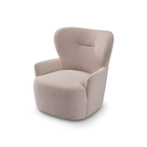 Lecce Bouclé Modern Accent Armchair in a contemporary living room, featuring a sculpted high back, flared arms, and soft textured upholstery for cozy sophistication.
