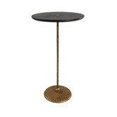 Lille Side Table featuring a round black-stained ashwood top and sturdy wrought iron base, blending rustic-industrial style with mid-century modern elegance.