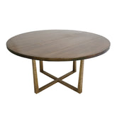 Lille Dining Table featuring a round brown-stained Ashwood top and hand-forged iron legs, blending mid-century elegance with industrial charm