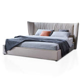 Modern top-grain Italian leather bed with steel and wood frame in a luxury bedroom interior