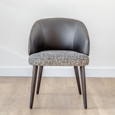 Luisa Dining Chair with dark grey fabric seat, black PU leather backrest, and ash wood frame, modern luxury chair for dining rooms or kitchens