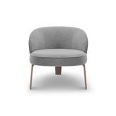 Orvieto Bouclé and Leather Modern Accent Armchair featuring a rounded seat, curved backrest, and brass metal legs — a perfect blend of luxury and sculptural design.