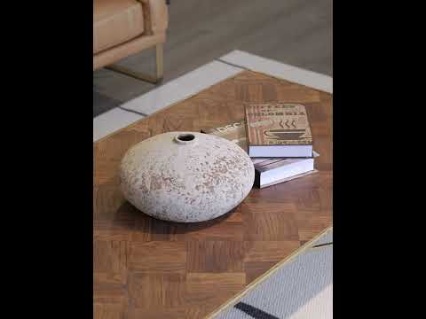 Video showcasing the Havre Coffee Table with its timber parquet top and brushed gold wrought iron base, highlighting mid-century craftsmanship and artistic design.