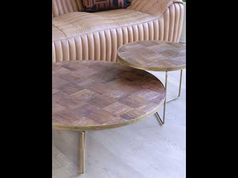 Video showcasing the Horten coffee table featuring a forged iron base and dual wood tops, highlighting its mid-century modern design and industrial durability