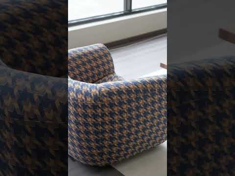 Video showcasing the Fano Lounge Chair with cotton and linen fabric, high-density sponge padding, and vibrant blue and orange pattern, highlighting its modern, unique, and mid-century design.