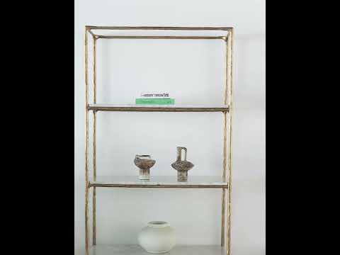 Video showcasing the Vanne Marble Shelf with four pristine white marble shelves and a wrought iron frame, highlighting its sleek open design, elegant stone finish, and versatile use as a bookcase, display shelf, or statement furniture piece.
