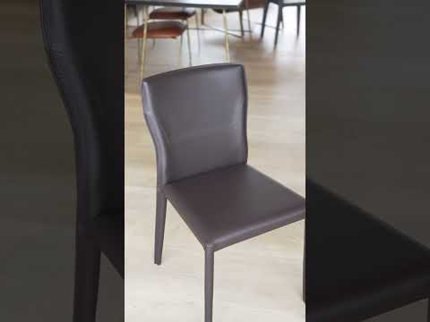 Video showcasing the Ancona Dining Chair with saddle leather upholstery, high-density sponge padding, and carbon steel frame, highlighting its sleek design, comfort, and durability.
