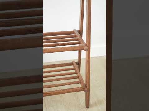 Elegant Vertue ash wood clothing rack featuring sleek hanging rod and versatile shelves, ideal for designer interiors
