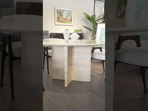 360-degree view of the Atrani Round Travertine Table highlighting its sleek circular design, smooth stone texture, and elegant modern aesthetic in a contemporary home setting.