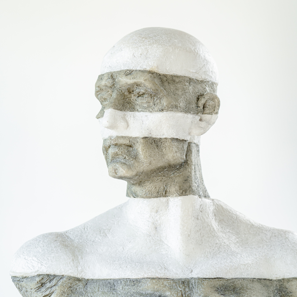 Modern decorative statue featuring a hunched-over male figure, designed with realistic details in marble and resin.