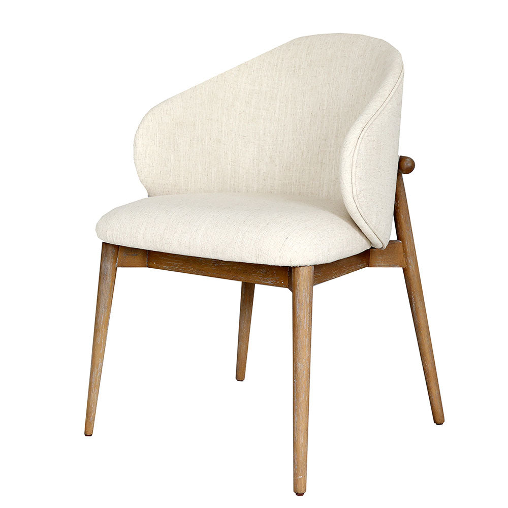 Aina Dining Chair featuring solid oak frame, oat-colored cotton blend upholstery, curved high back, and 4.2 layers of foam for classic comfort and elegance.