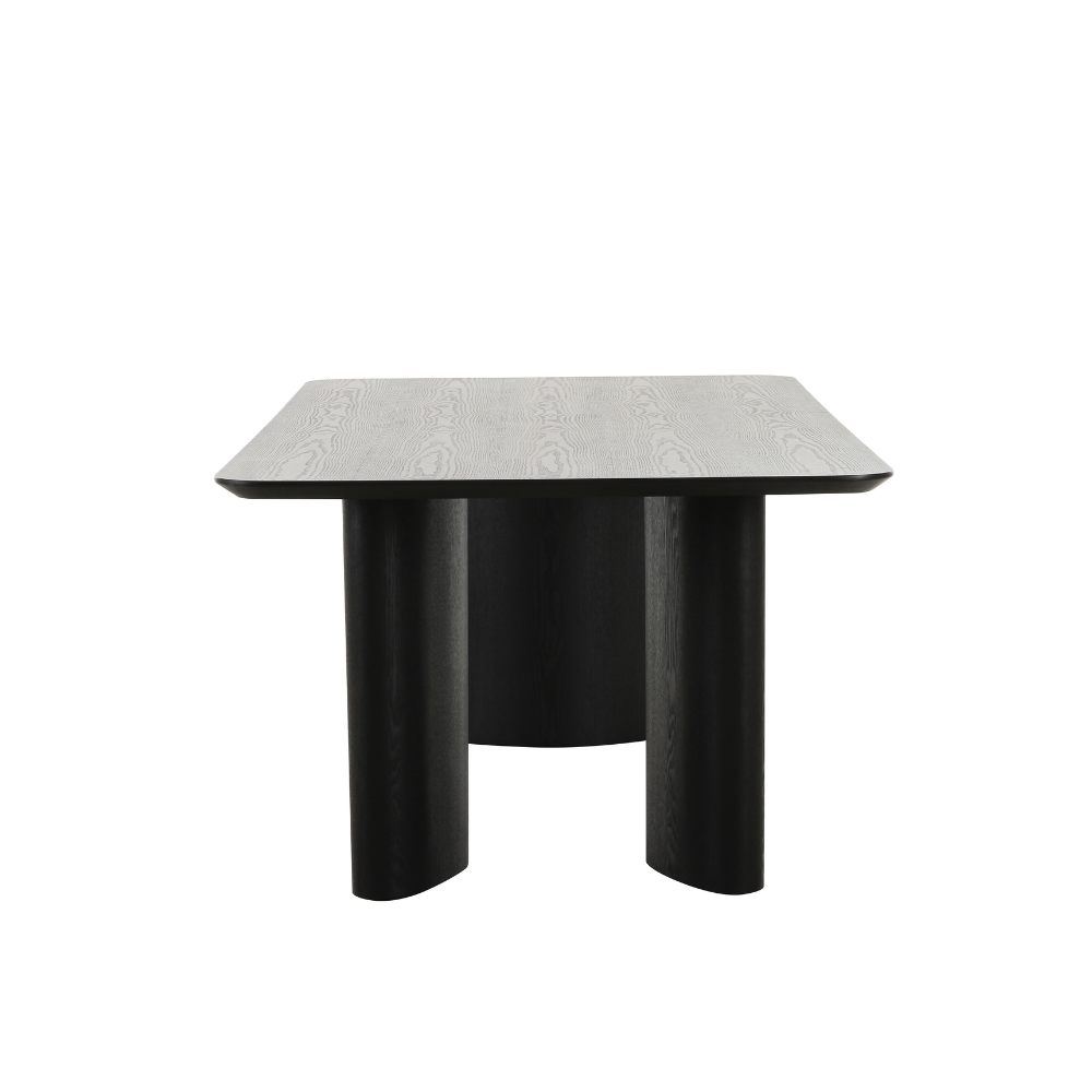 Contemporary Ankara dining table with rich dark ash surface and bold sculptural legs, blending modern and classic design.