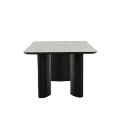 Contemporary Ankara dining table with rich dark ash surface and bold sculptural legs, blending modern and classic design.