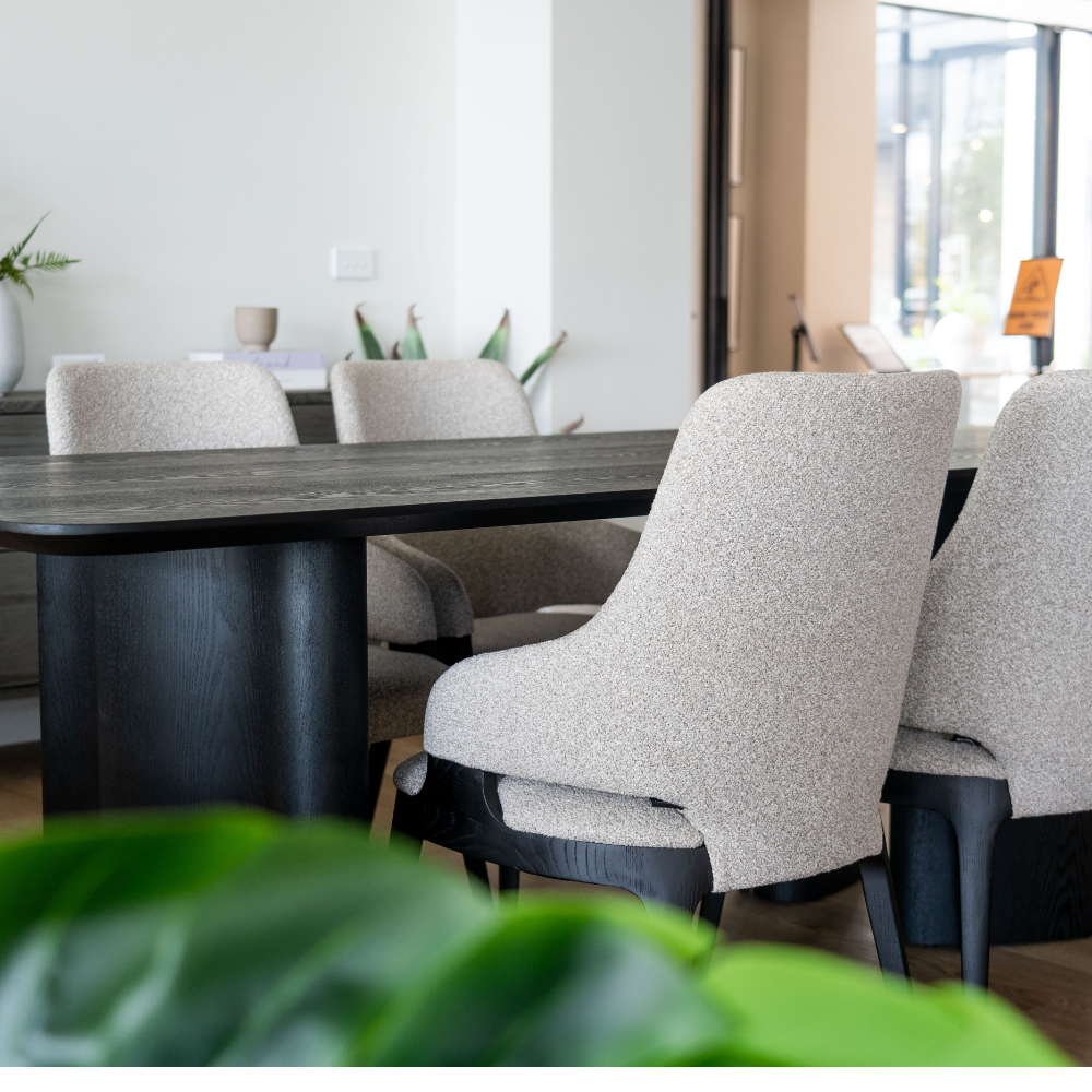 Stylish Ankara dining table crafted in dark ash with distinctive geometric leg design, ideal for modern dining spaces.