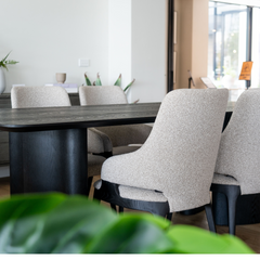 Stylish Ankara dining table crafted in dark ash with distinctive geometric leg design, ideal for modern dining spaces.