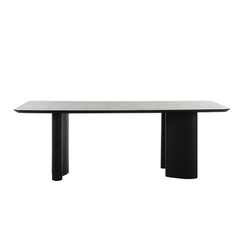 Modern Ankara dining table featuring rectangular dark ash top and striking sculptural legs for contemporary interiors.