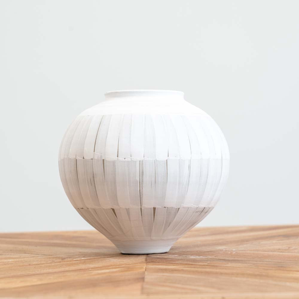 Medium hand-painted ceramic vase with white-washed finish and lined pattern, ideal for fresh or dried flowers and modern or boho décor.