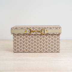 Aris storage box handwoven with premium materials and accented with a gold-tone clasp.