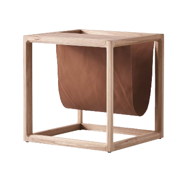 The Brace Side Table showcasing a sturdy elm wood frame paired with built-in leather book storage for stylish organization.
