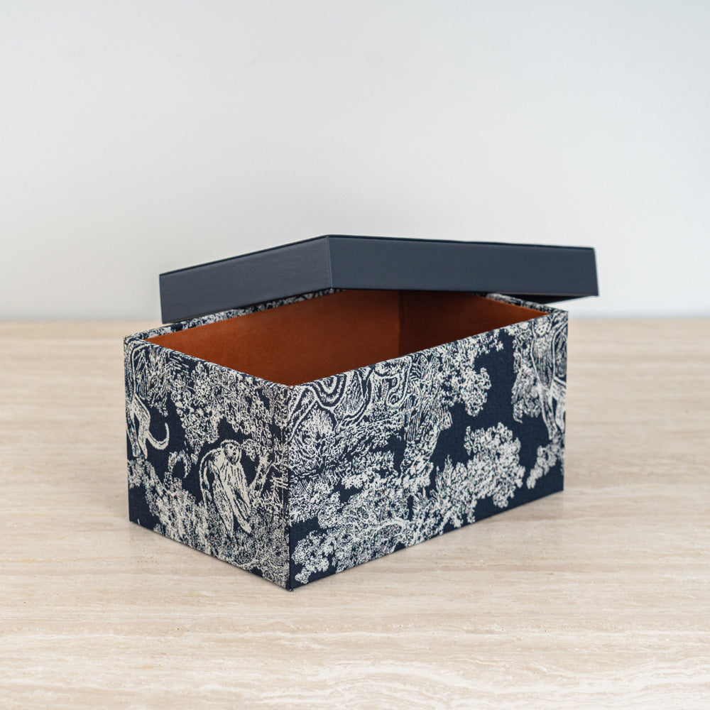 Art-inspired storage container with sleek lid for organizing documents, accessories, or essentials.