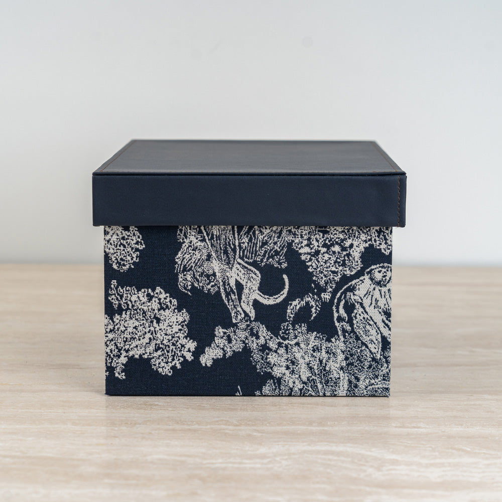 Stylish black and ivory organizer box designed to keep accessories and keepsakes neatly stored.