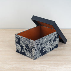 Chic and durable storage bin with artistic print and stackable form for easy space-saving.