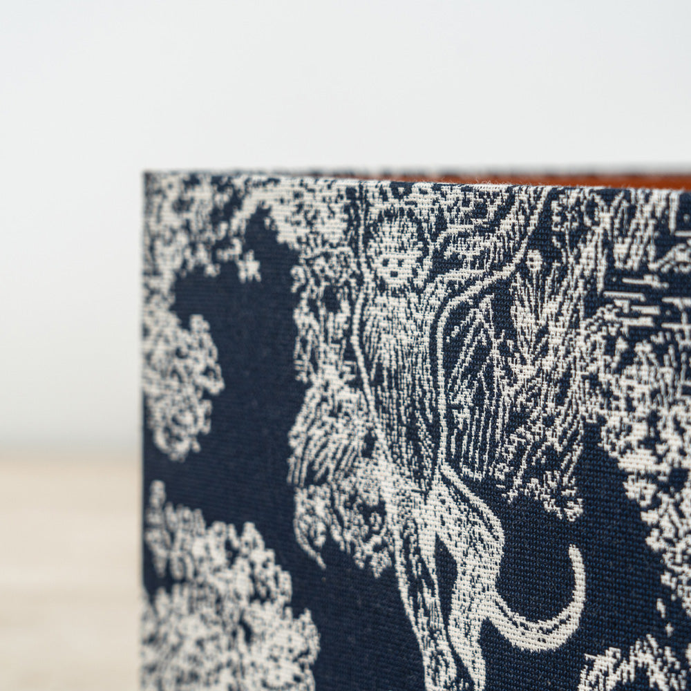 Patterned home organizer box featuring a striking floral motif and sturdy lid.