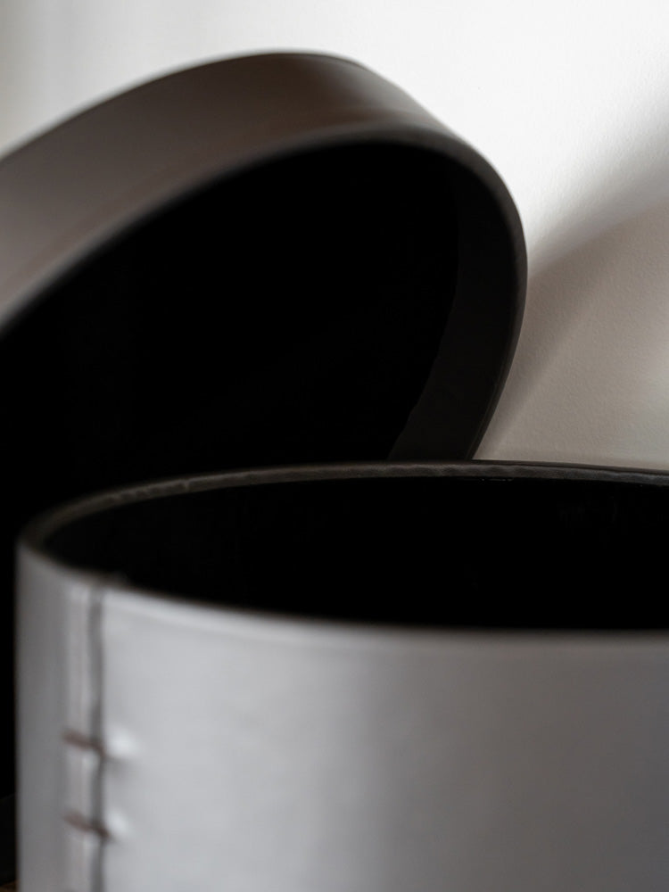 Elegant small circular storage box crafted from hand-woven bridle leather, perfect for organizing jewelry, accessories, or small household essentials in modern and luxury interiors.