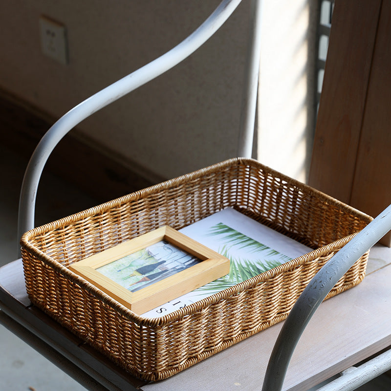 Classic rectangular storage basket designed in plastic rattan, ideal for holding accessories, toiletries, or household items.