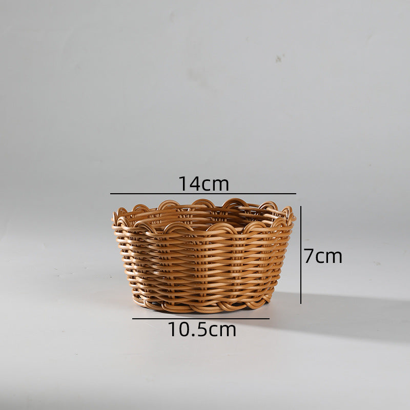 Classic scallop-edge bowl basket crafted from durable plastic rattan, versatile for storage, serving, or decorative use.