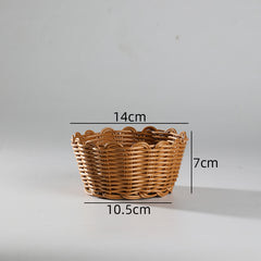 Classic scallop-edge bowl basket crafted from durable plastic rattan, versatile for storage, serving, or decorative use.