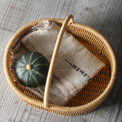 Classic shallow oval storage basket in durable plastic rattan, lightweight and versatile for storage or decorative use.