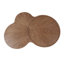 Two wooden coasters with a starburst pattern on a white background