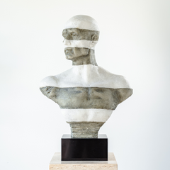 A detailed sculpture of a man sitting with legs extended, crafted from marble and art resin in a contemplative pose.